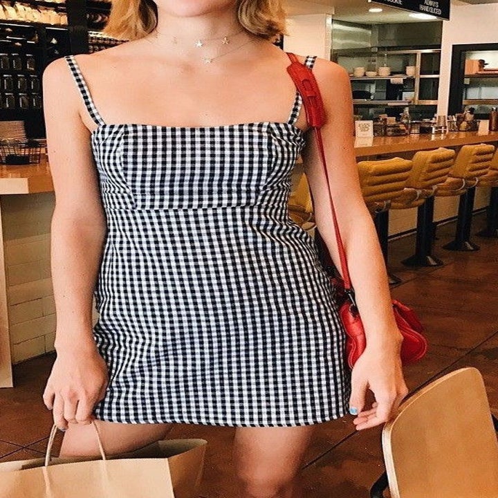Model wearing plaid dress
