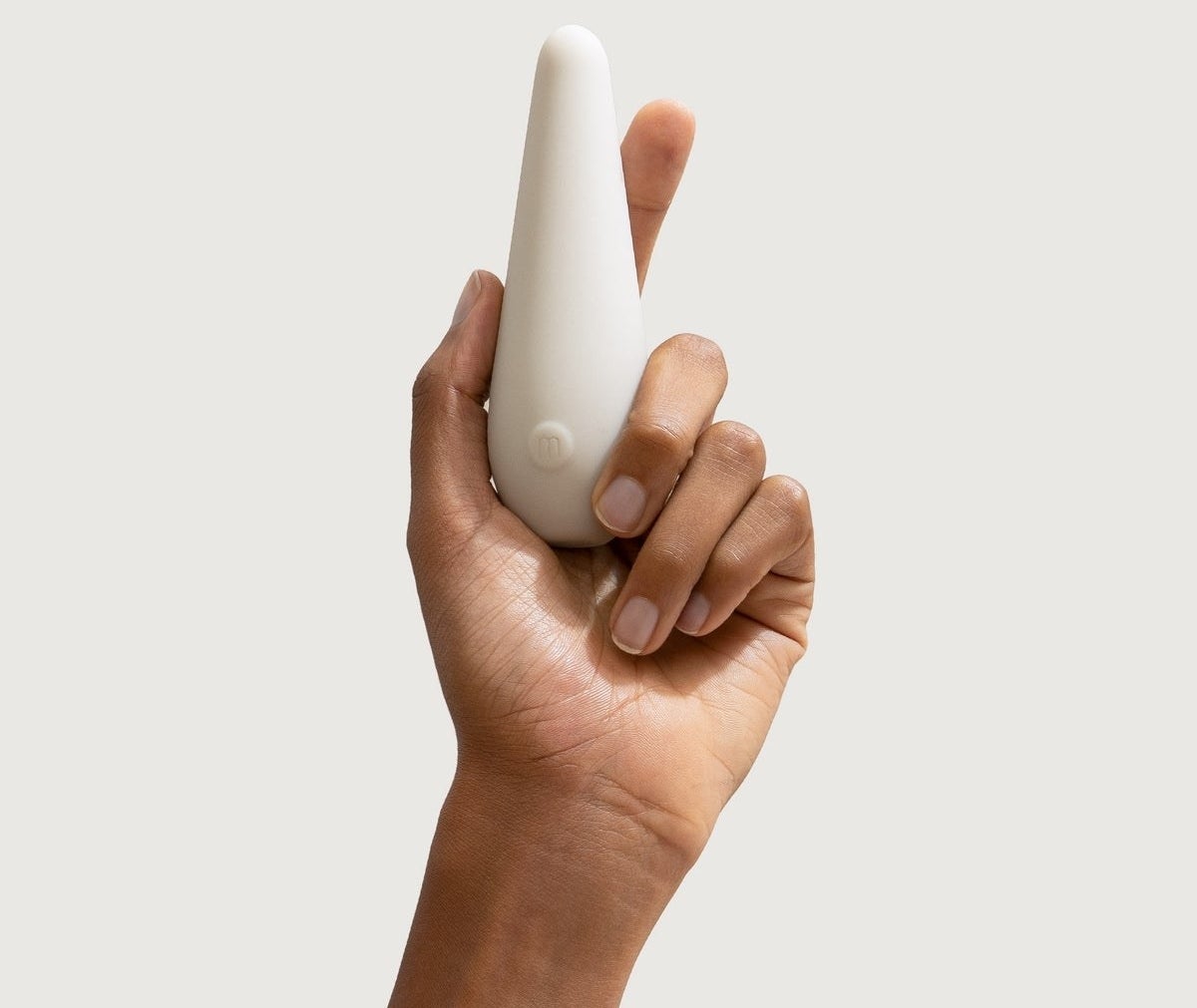 Model holding clay minimalist vibrator