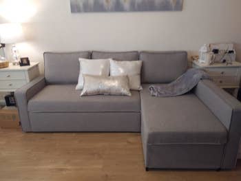 reviewer photo of gray sectional sofa in a living room