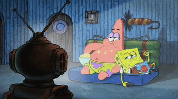 Patrick and SpongeBob from &quot;SpongeBob SquarePants&quot; eating chips while watching TV
