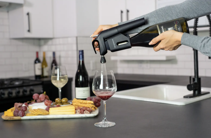 system attached to a wine bottle, showing how it pours a glass of wine