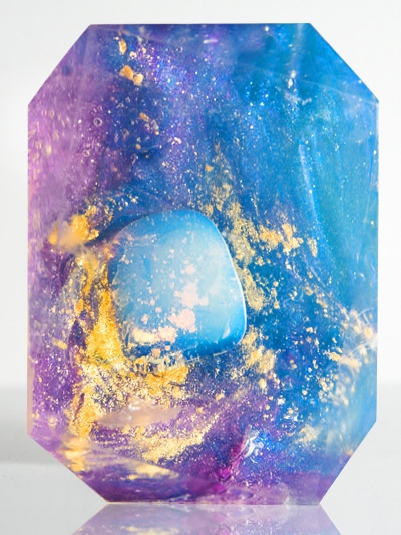 the translucent blue and purple bar, with gold flecks and a crystal stone in the center