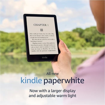 model reading a kindle paperwhite