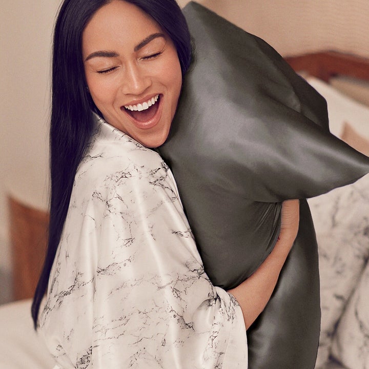 Model hugging silk pillow