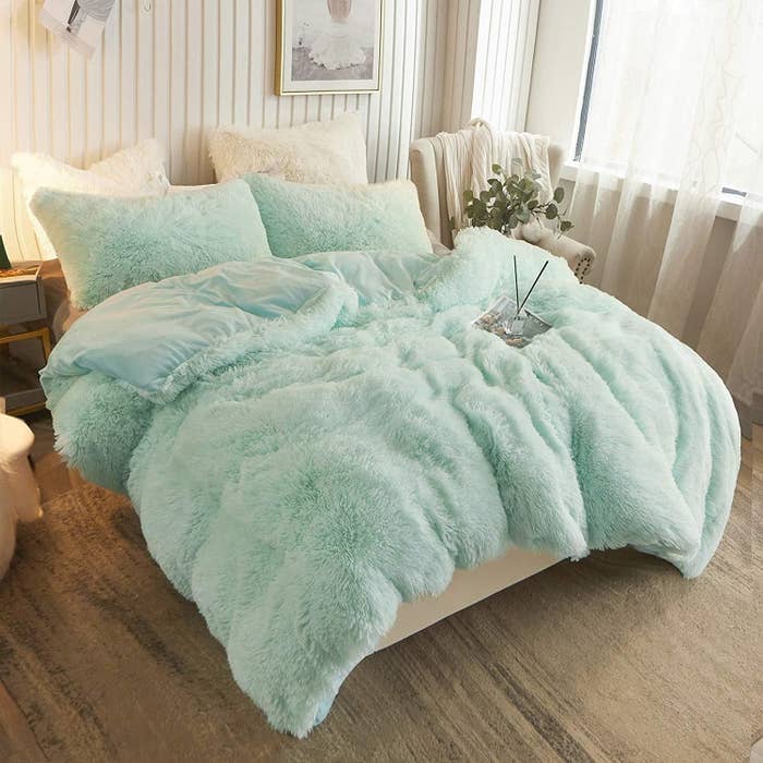 a fluffy duvet cover with matching pillows
