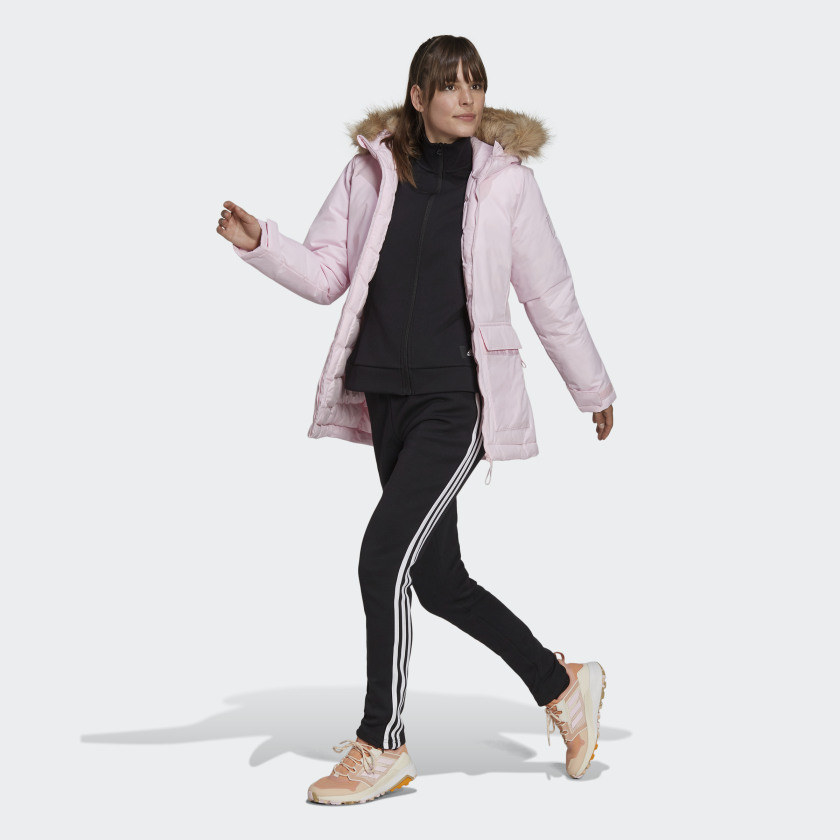 Model wearing the pink parka with faux-fur trim on the hood