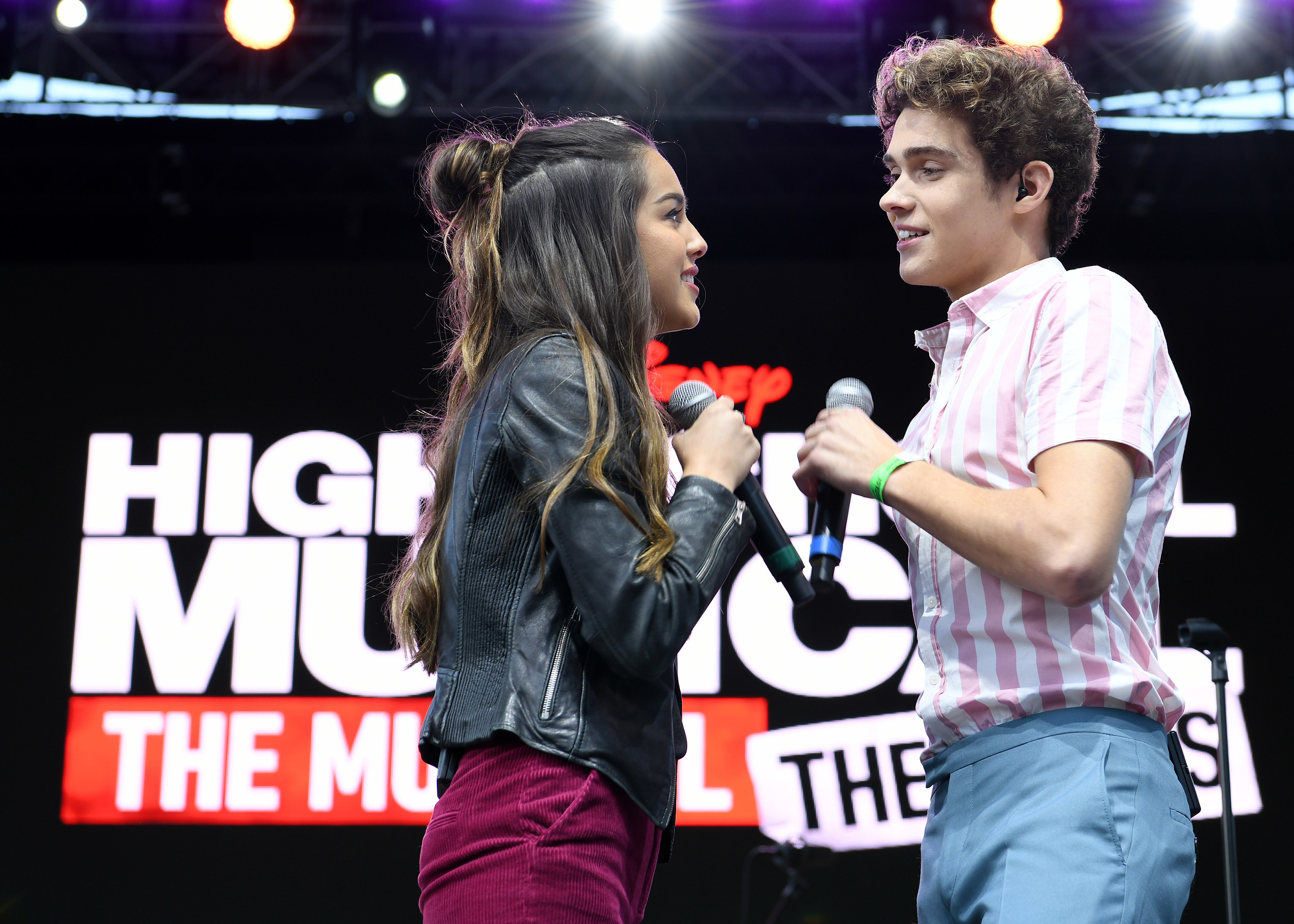 Olivia Rodrigo and Joshua Bassett performing at a High School Musical: The Musical event