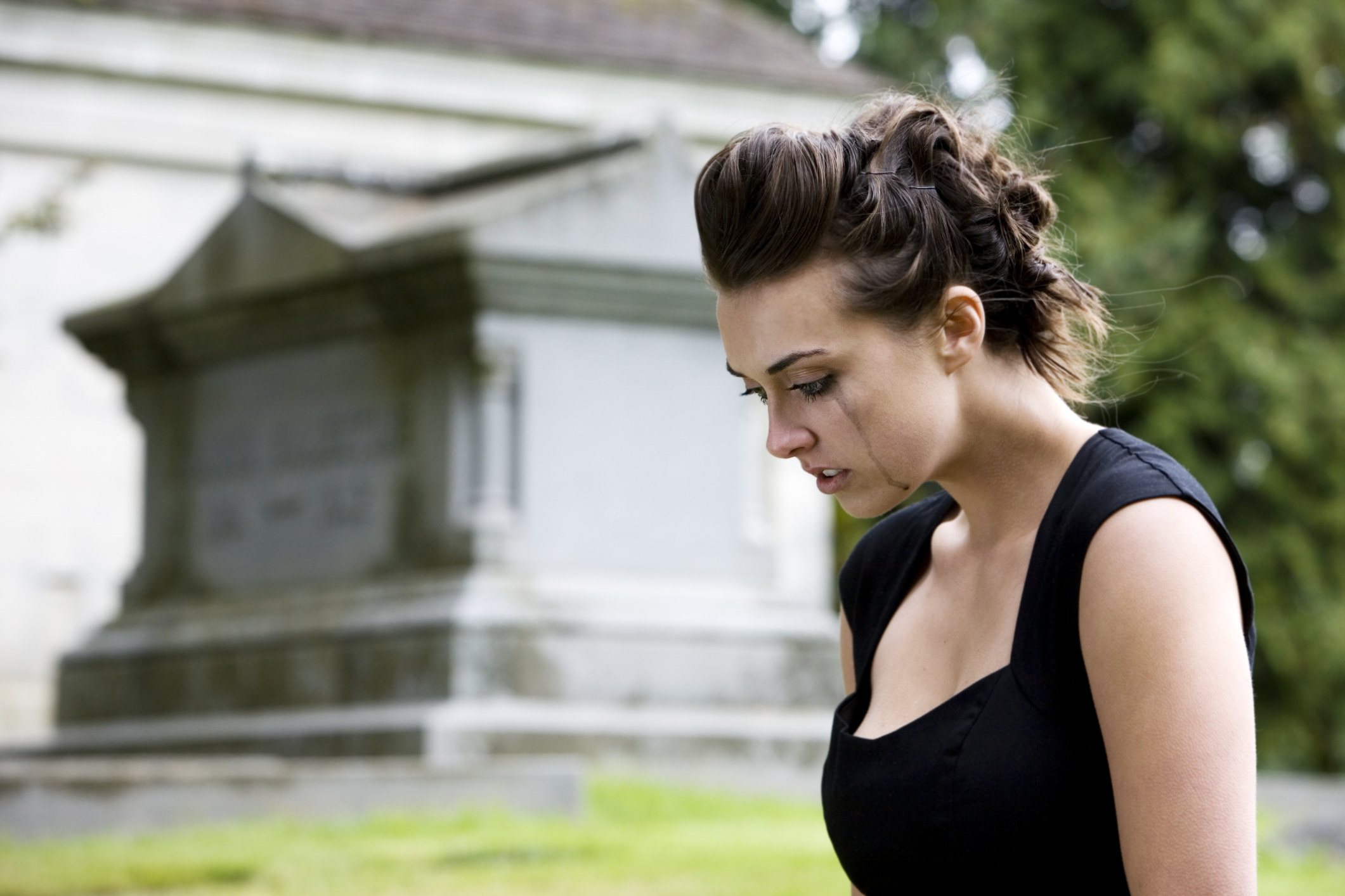 woman crying at a funeral