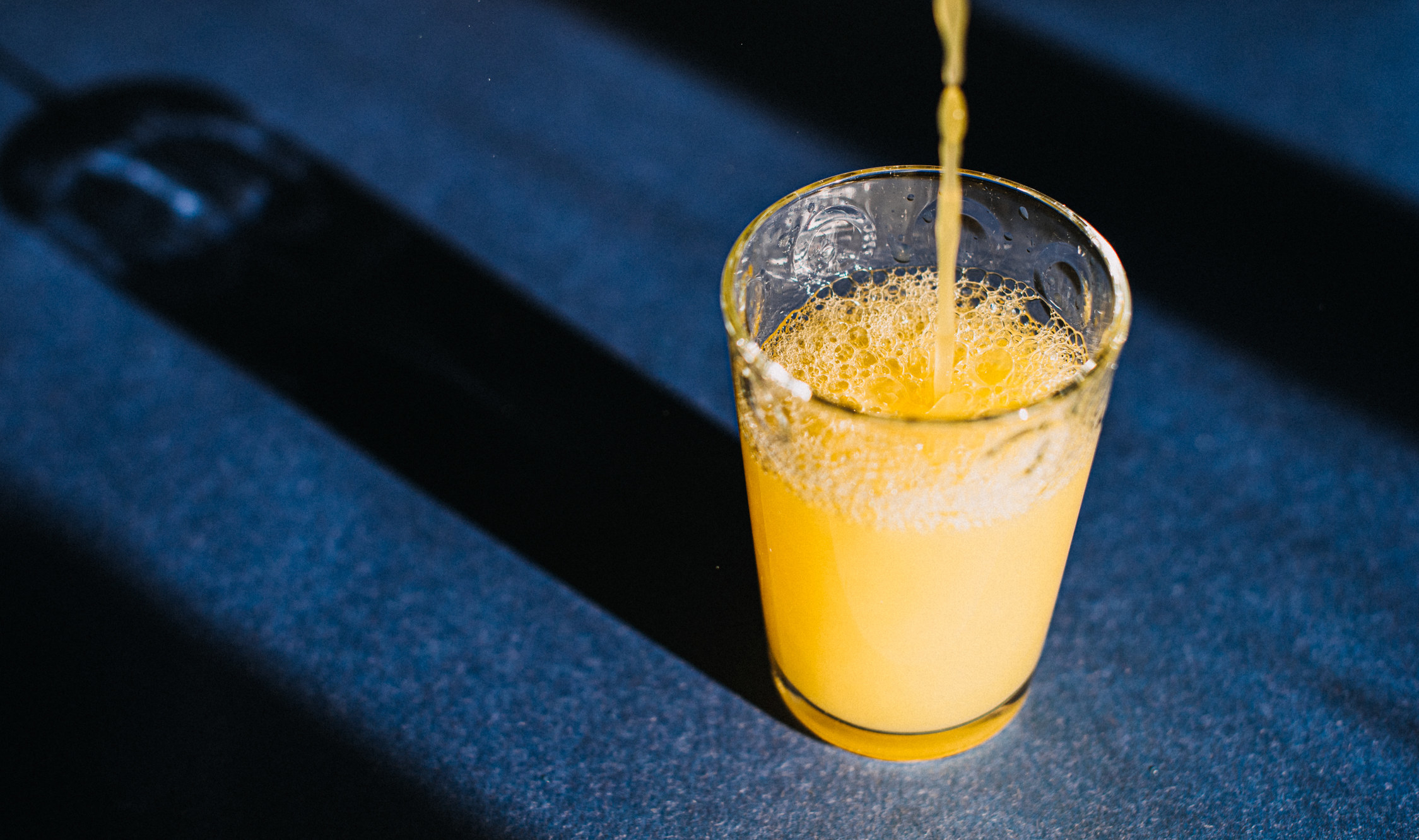 orange juice poured into a cup