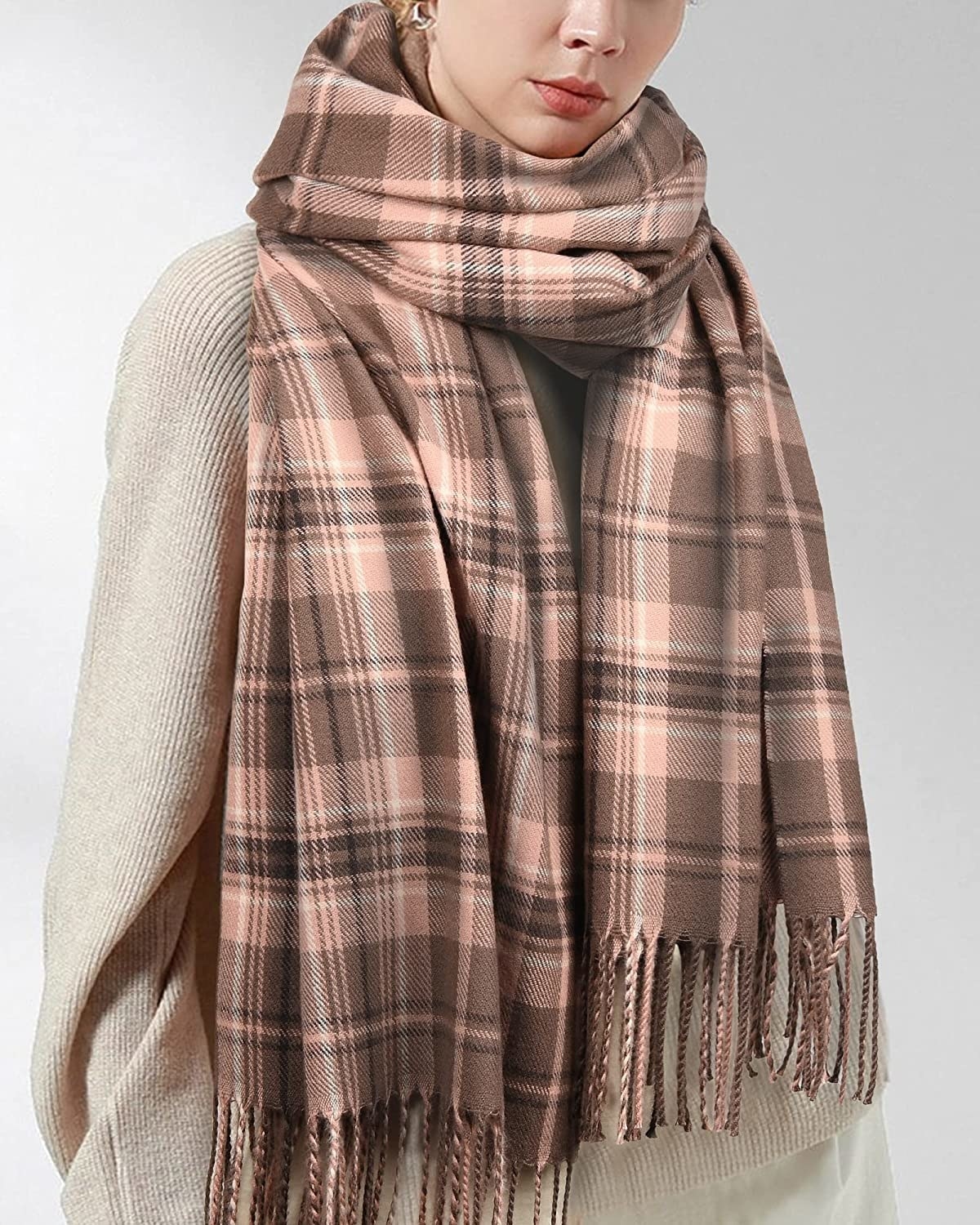 Model in the brown plaid scarf with fringe