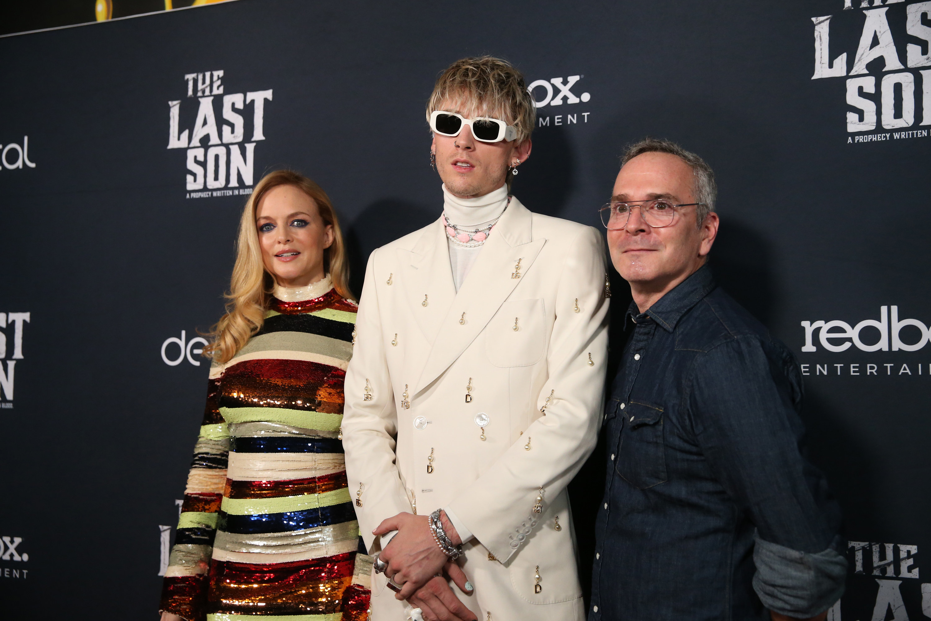 Heather Graham and MGK pose with the movie&#x27;s director Tim Sutton on the red carpet