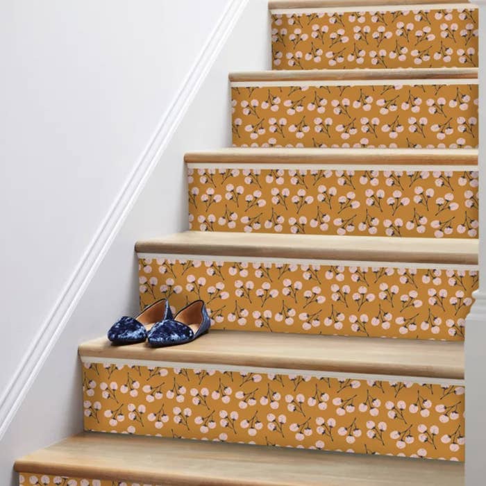 Orange and pink flower wallpaper on stairs