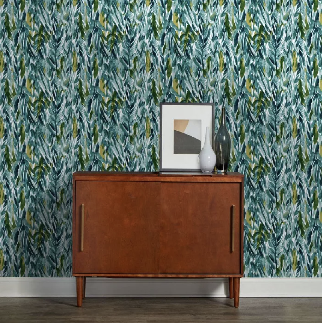 Green, blue, and teal leaf patterned wall behind hutch