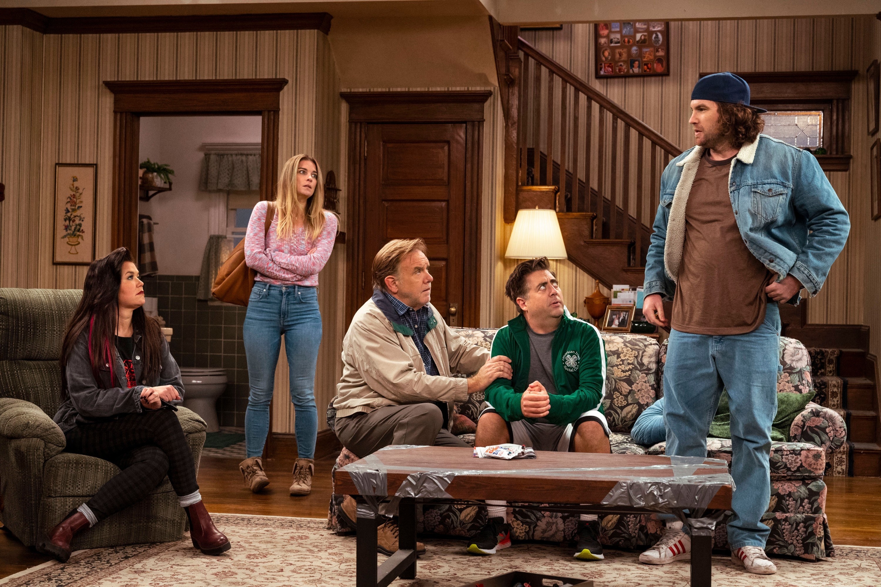 The cast in the sitcom living room set