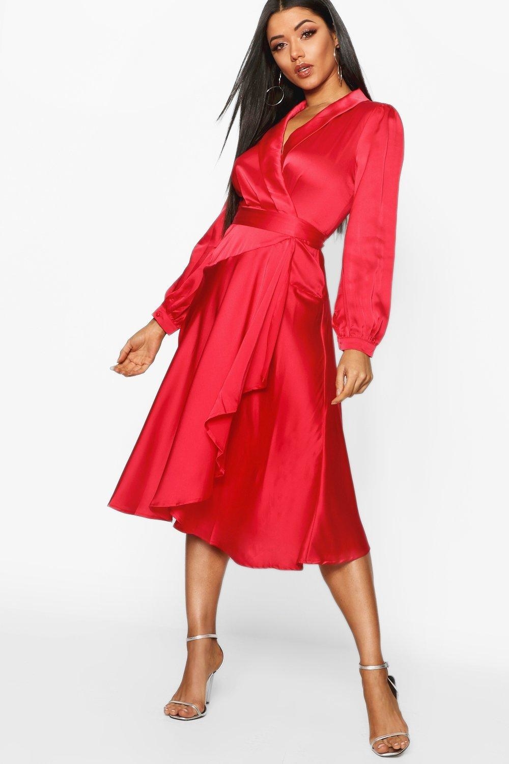 Model wearing red midi dress with deep neckline