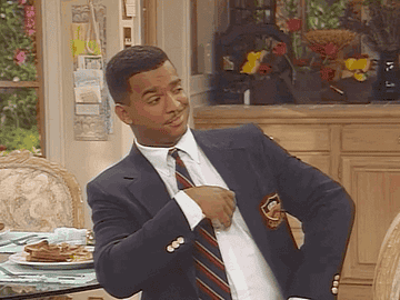 Carlton from &quot;The Fresh Prince of Bel-Air&quot; resting his head on his hand while sitting in the kitchen.