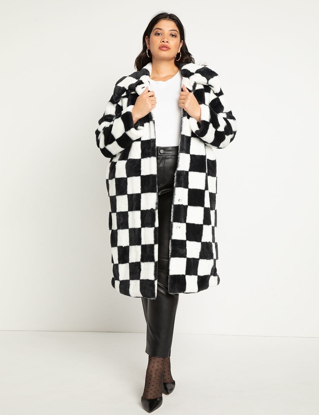 A model in the check coat