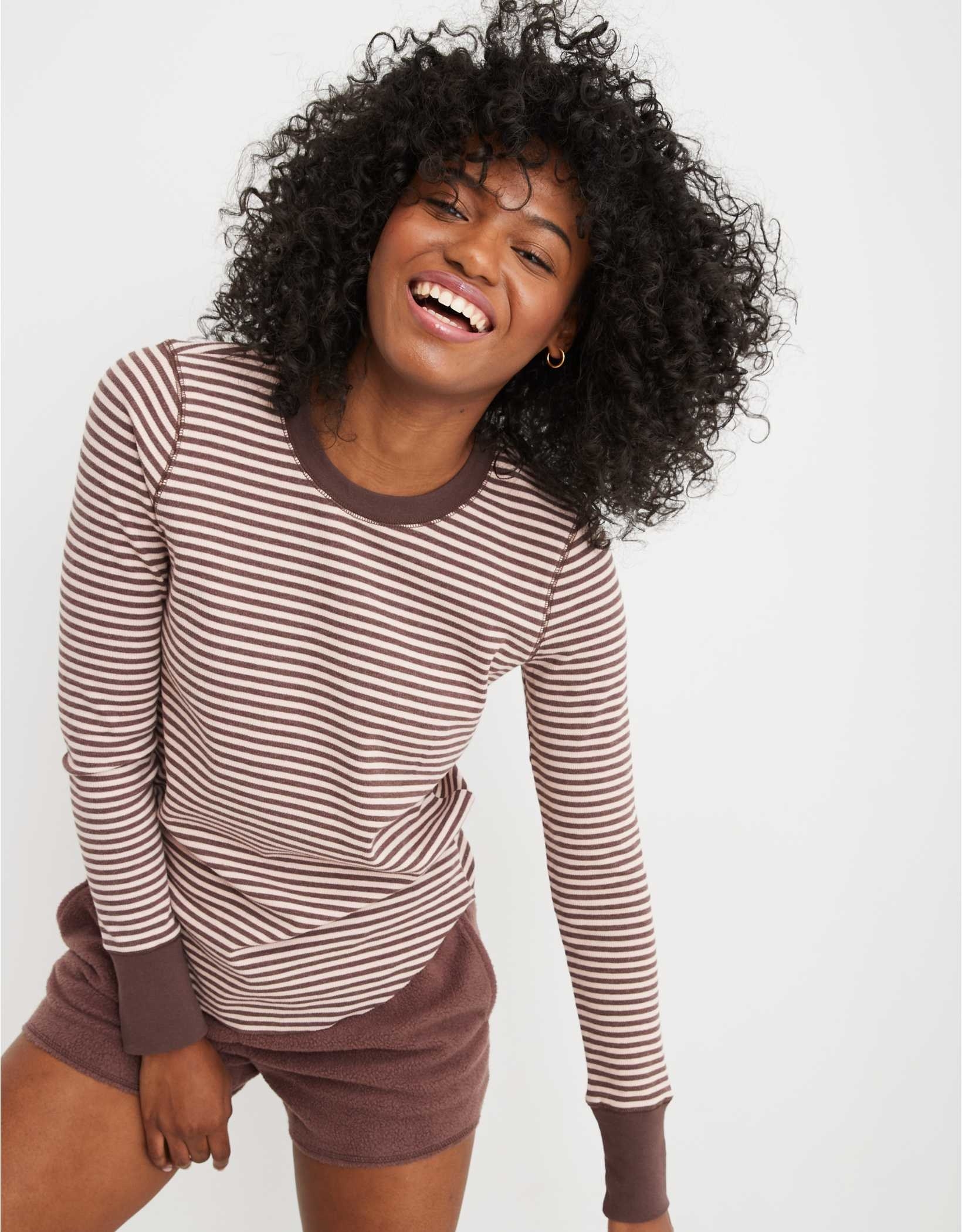 model in brown and cream round neck striped long sleeve tee