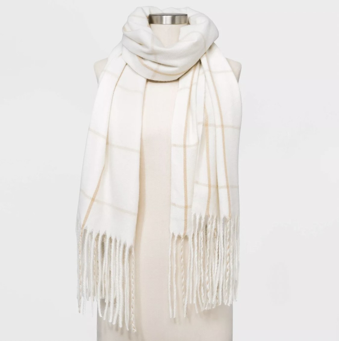 White plaid blanket scarf on mannequin