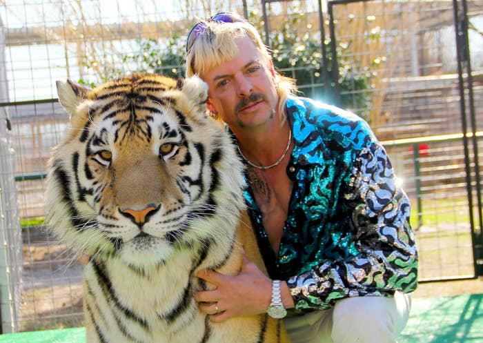 Joe poses with a tiger