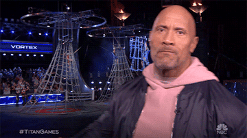 The Rock shaking his fist in the air on the set of the