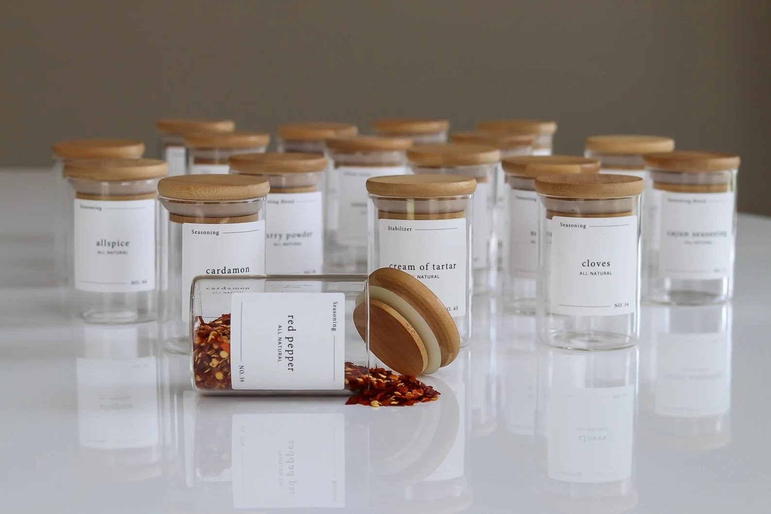 clear jars with wooden sealed lids. each is labeled with a simple paper.