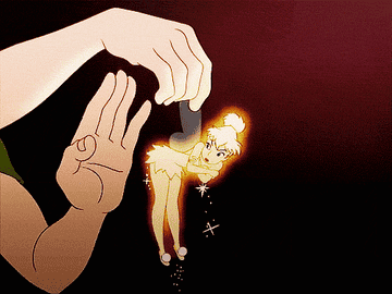 gif of peter pan holding tinkerbell by the wing as she sets of pixie dust