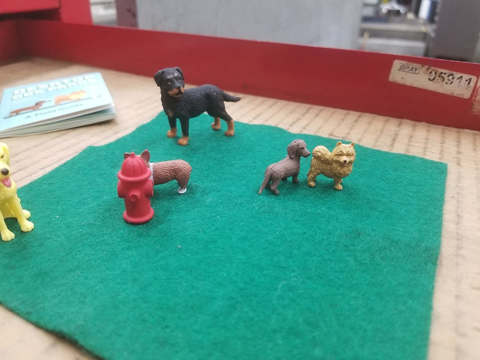 green mat with oy dogs and fire hydrant
