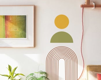 the yellow, green, and red decal on a wall