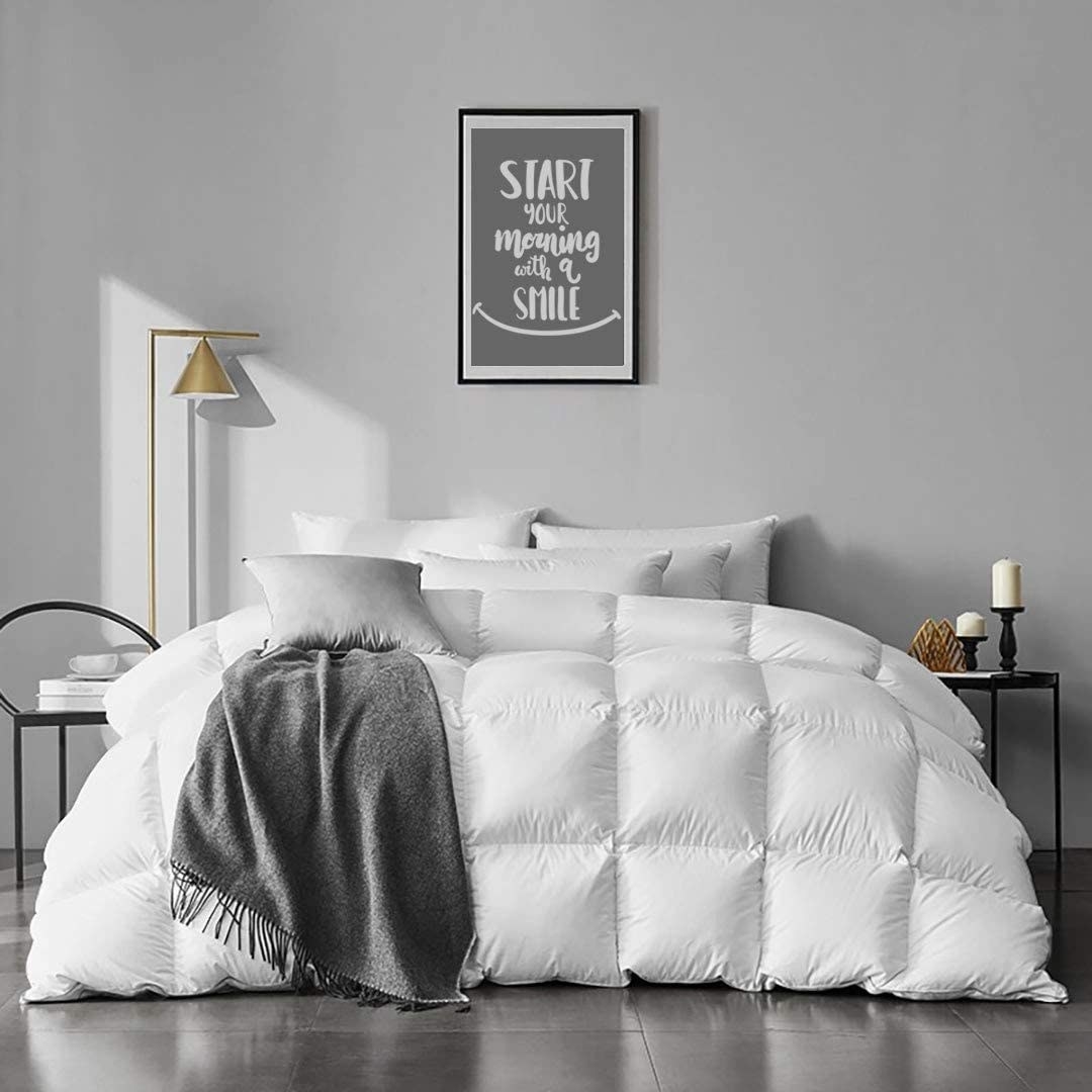 the white quilted comforter on a bed