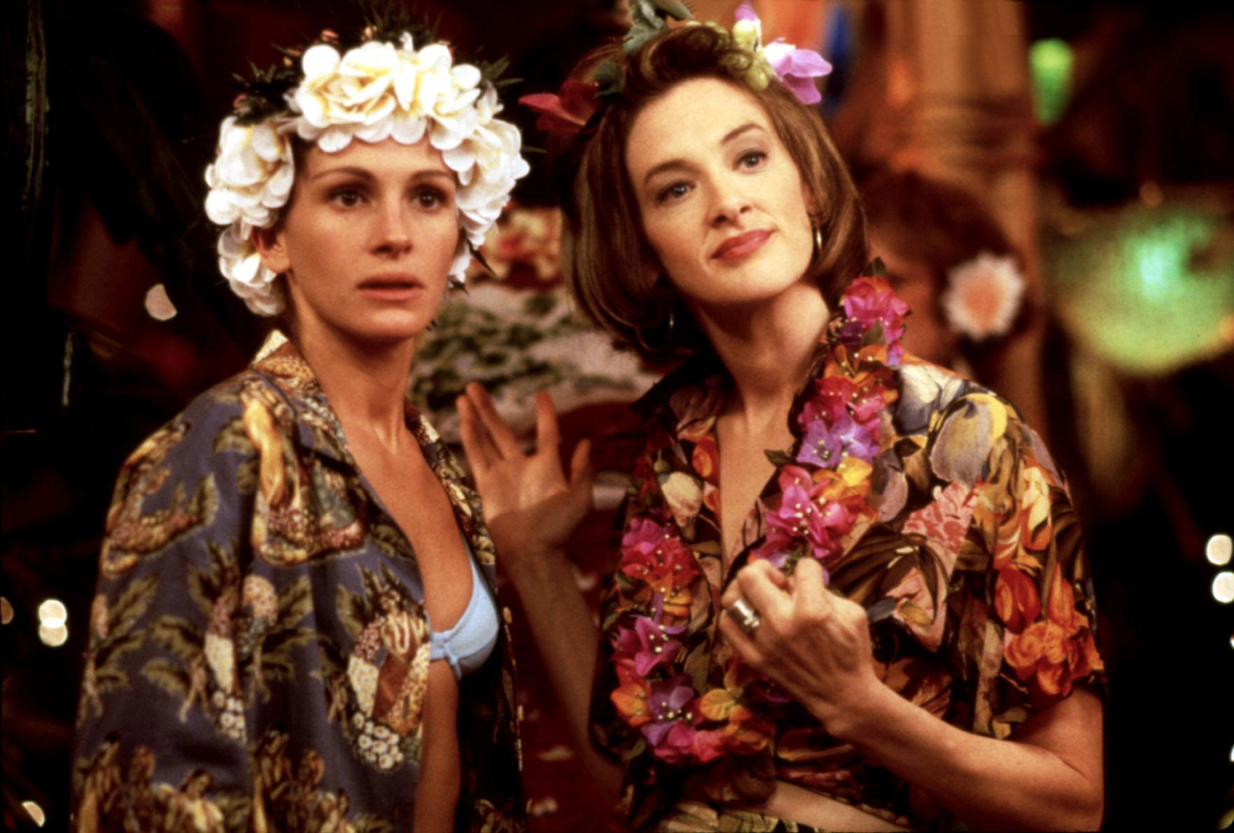 Julia Roberts and Joan Cusack wear Hawaiian shirts and leis