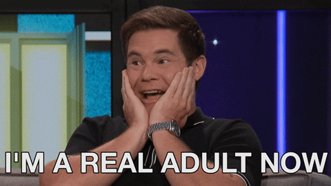 Adam Devine holding his face with his hands saying "I'm a real adult now"