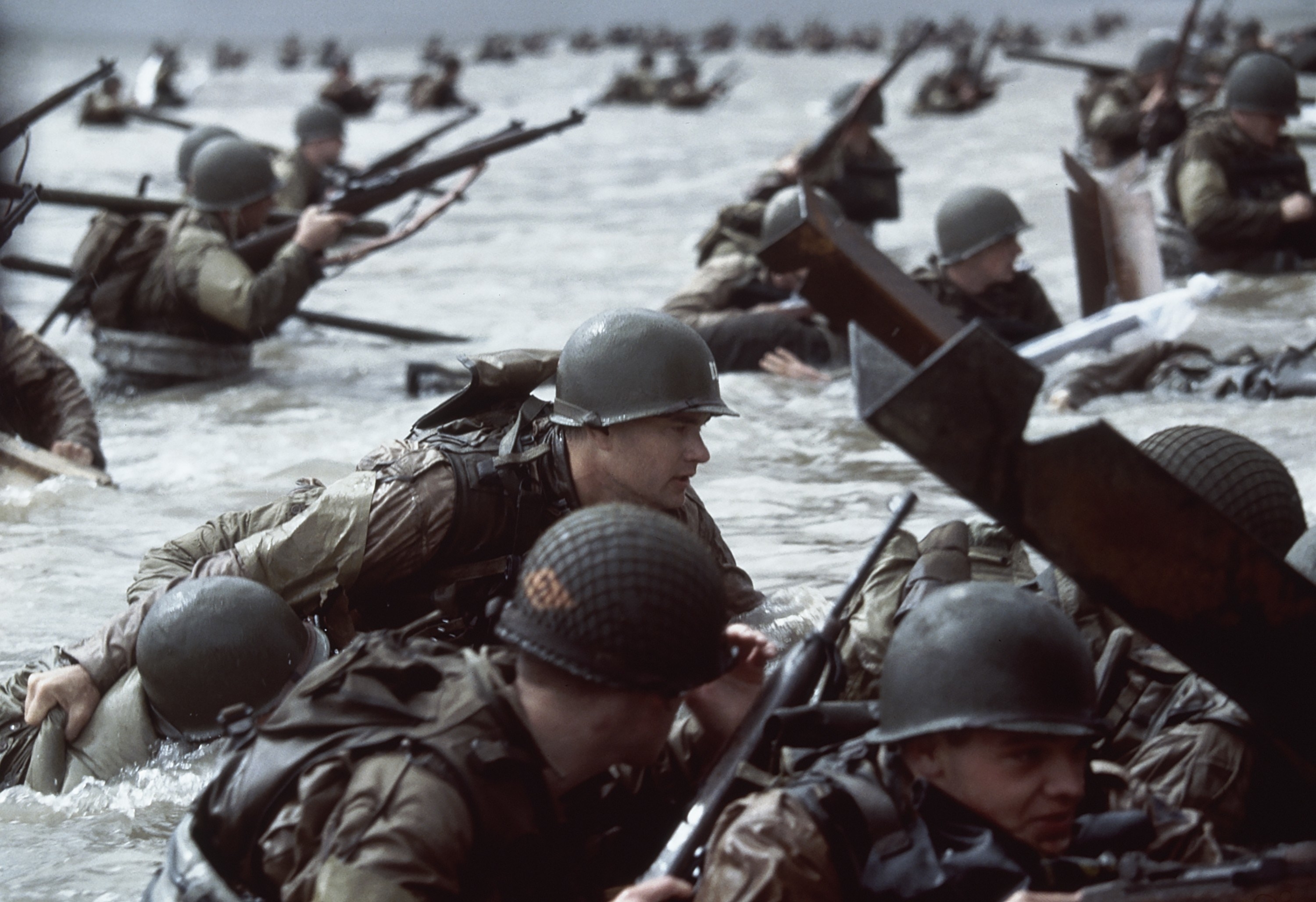 Tom Hanks comes ashore at Normandy with other soldiers
