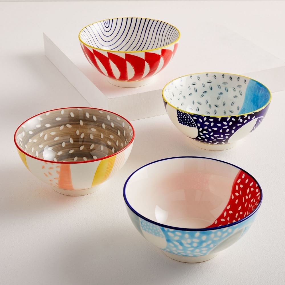 Set of four multi-colored bowls with speckles decorated