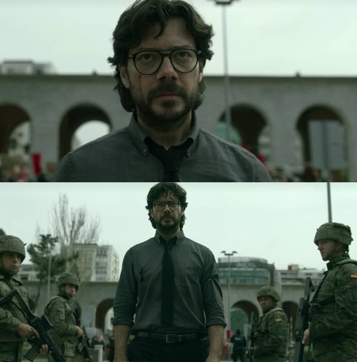 A close up of The Professor as he walks through two lines of soldiers