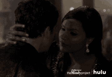 Chris Messina as Danny and Mindy Kaling as Mindy kiss in the rain in