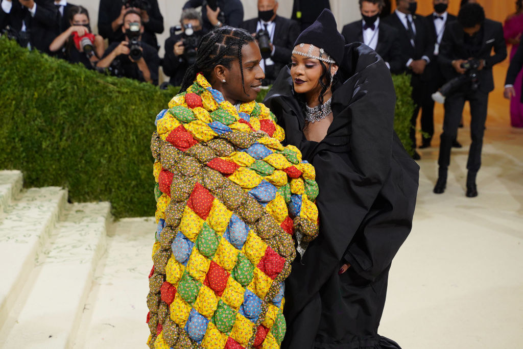 asap rocky wearing a patchwork shawl looking at rihanna