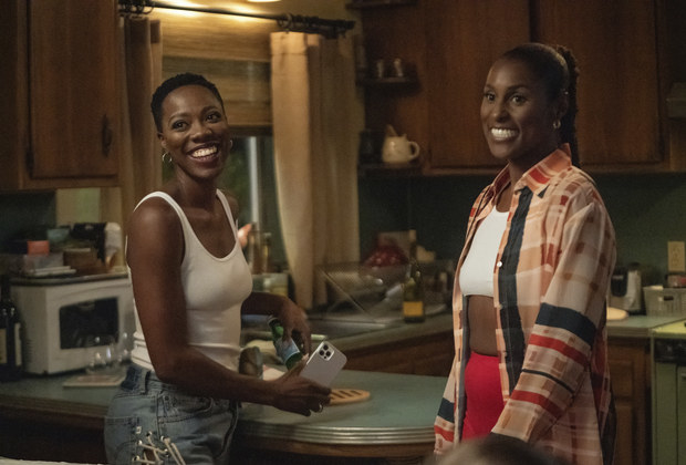 yvonne orji and issa rae laughing in a kitchen as molly and issa in insecure