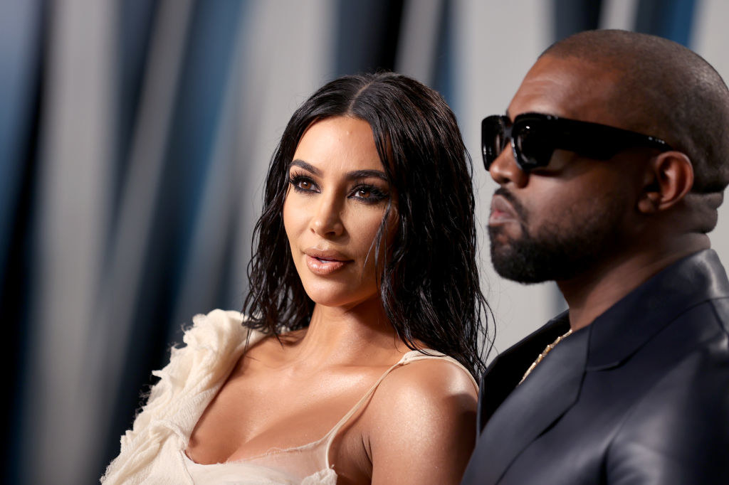 Kim Kardashian and Kanye West posing on the red carpet