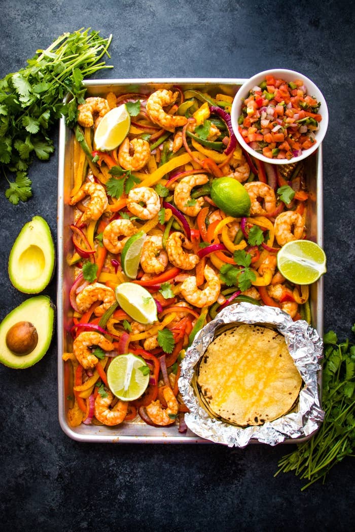 Shrimp, belll peppers and onions baked on a sheet pan and served with corn tortillas and salsa.