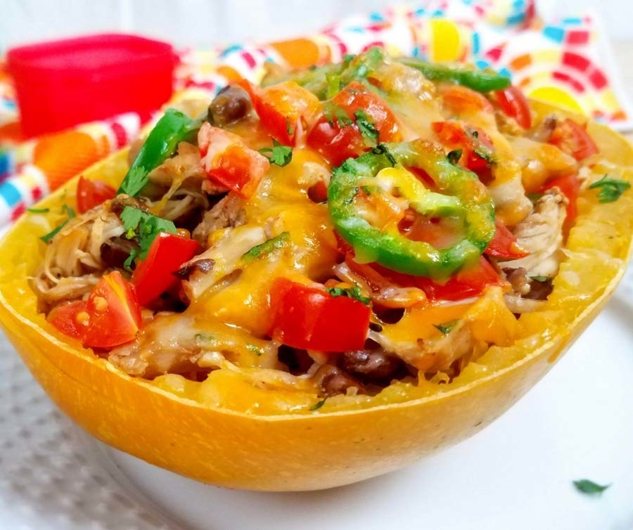 Taco meat, black beans, and southwestern ingredients in a spaghetti squash bowl.
