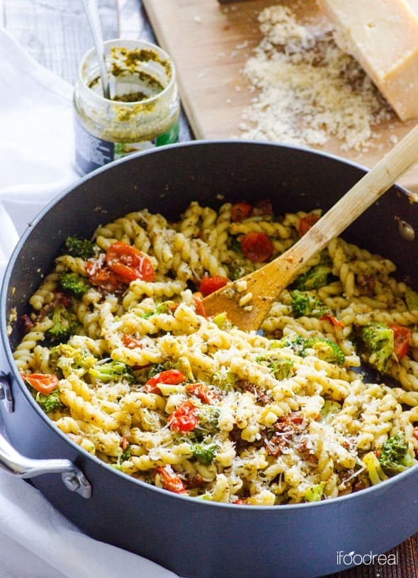 Ready in just over 30 minutes this pasta dinner recipe is bursting with flavor from pesto, sun-dried tomatoes, broccoli and Parmesan cheese.