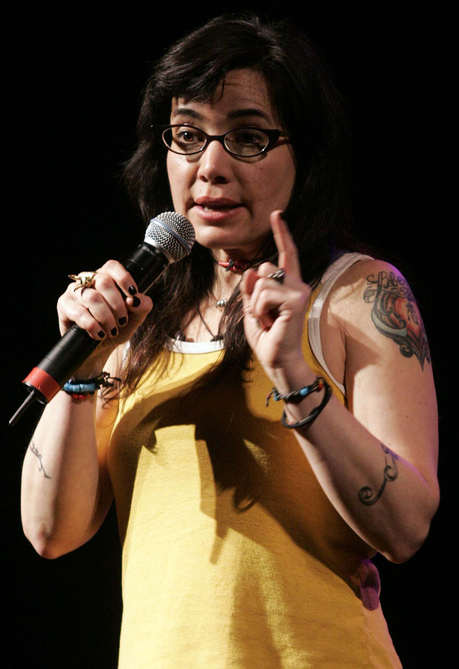 Janeane Garofalo performing onstage at the Somerville Theater