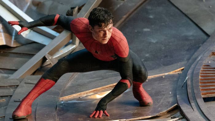 Tom in the Spider-Man suit as he lands