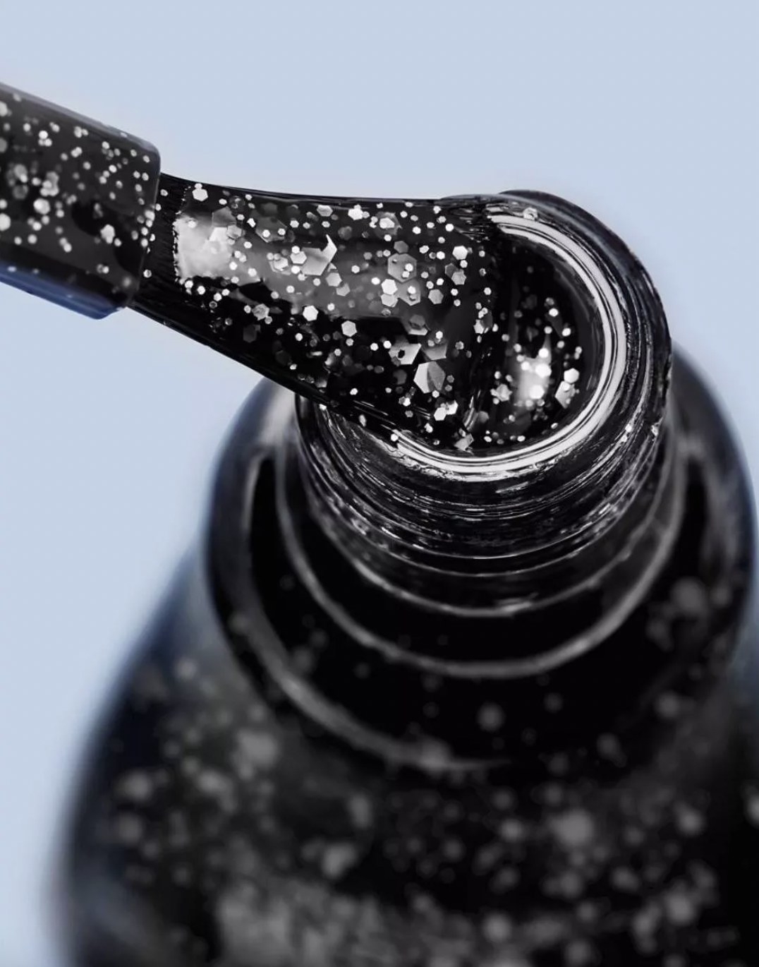A bottle of black shimmer nail polish