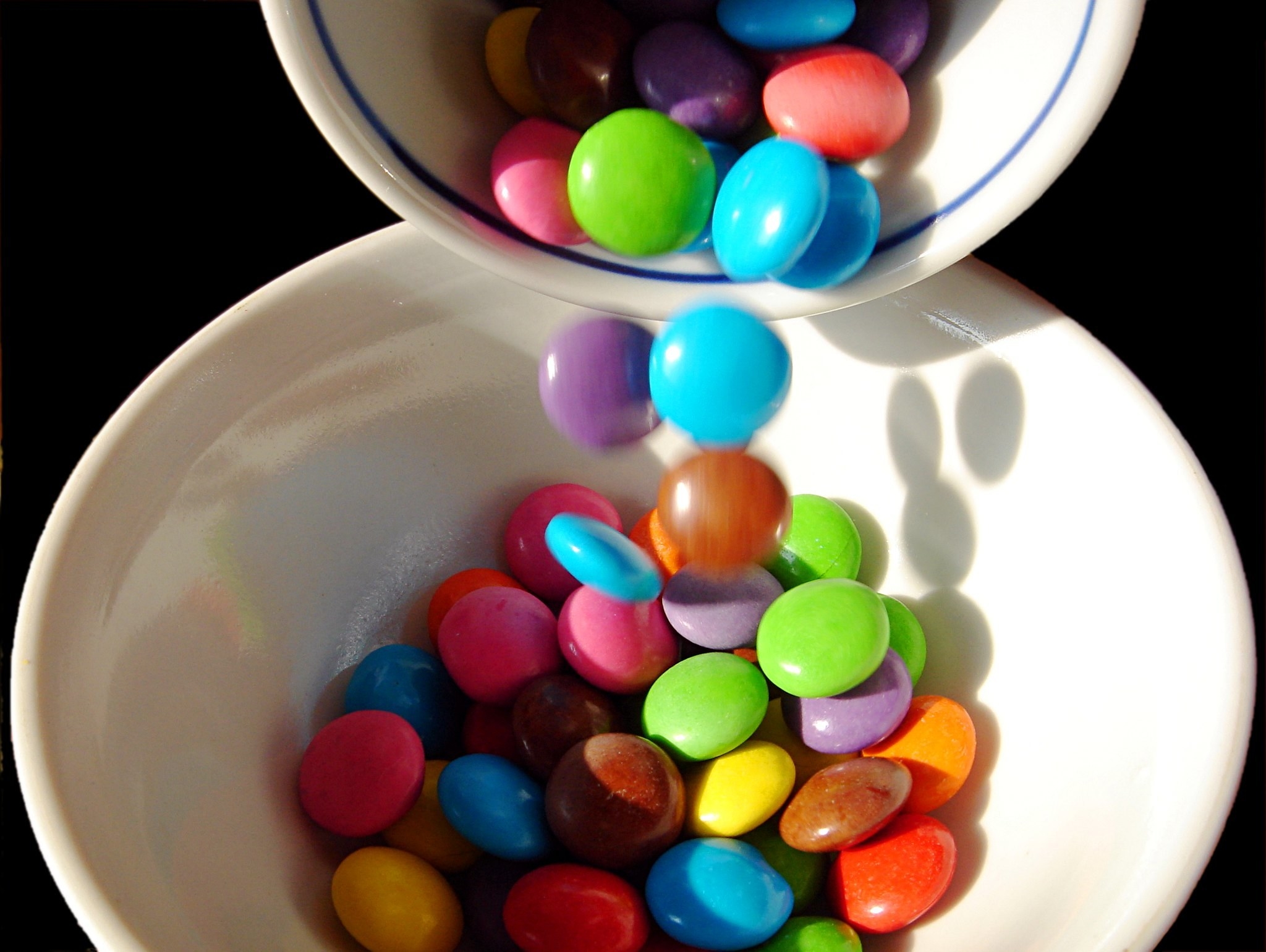 Smarties being poured into a bowl
