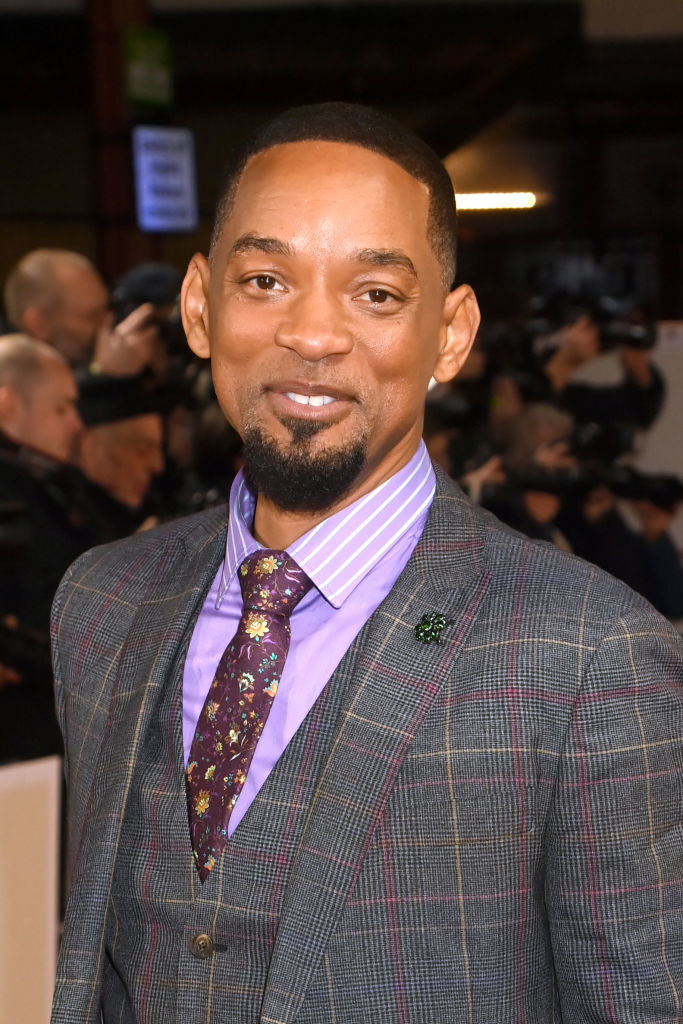 Will Smith in a checkered suit and floral tie