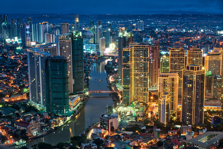 A night shot of the Manila skyline which is filled with skyscrapers