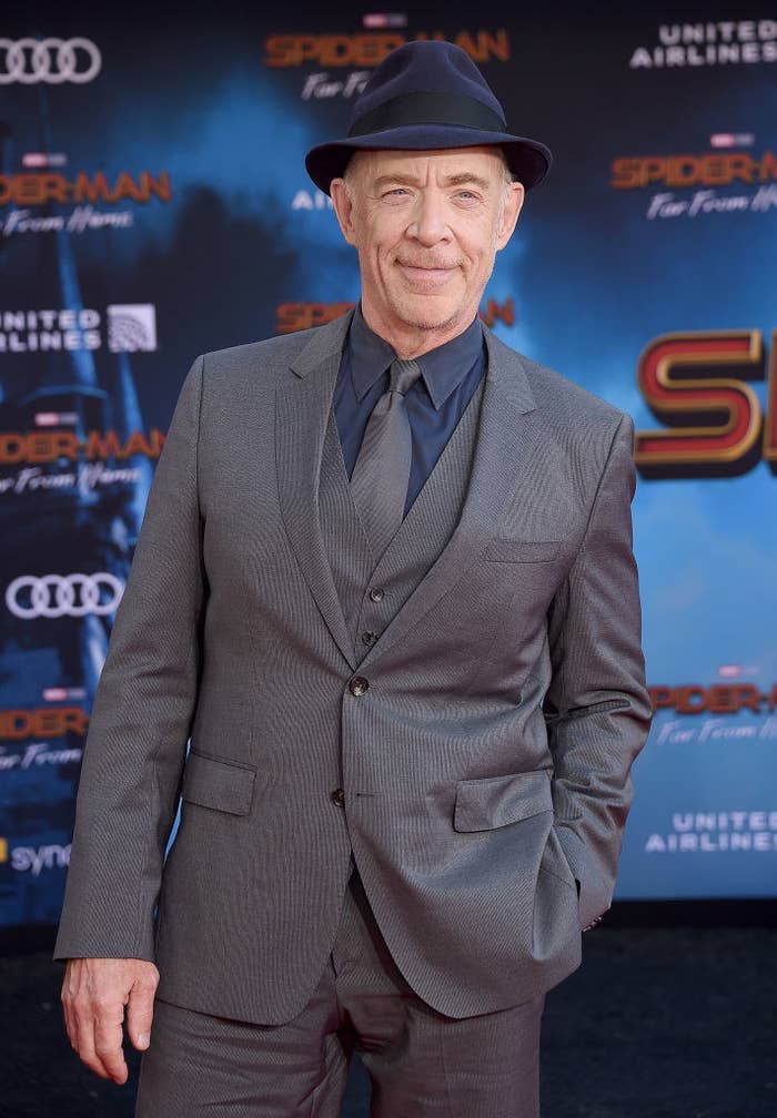 J.K. wearing a suit and a fedora at the premiere of Spider-Man Far From Home