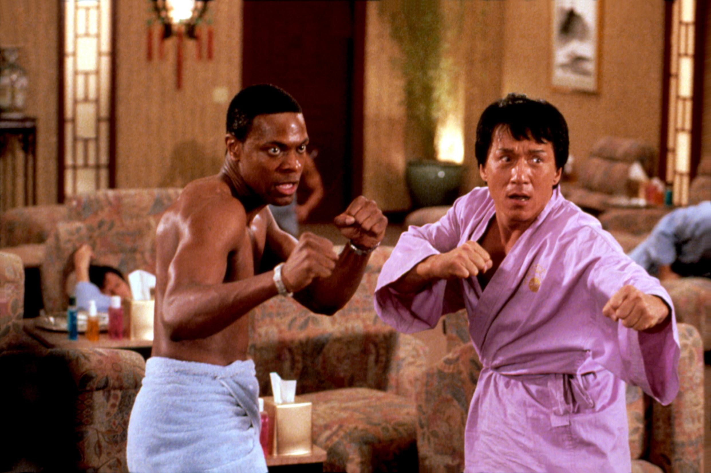 Chris Tucker and Jackie Chan preparing to fight in robes